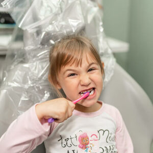 happy-little-girl-brushing-her-teeth