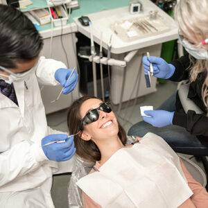 Bremerton dentists work with a patient, for gum disease at Safe Harbor Smiles