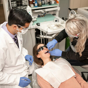Bremerton dentists and-his-patient-removing-a-tooth-from-a-patient