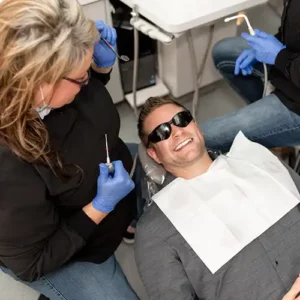 Bremerton Dentist cleaning teeth for patient at Safe Harbor Smiles, your Family Dentistry - Dentist Near Me, Bremerton dentist - Emergency Dentist